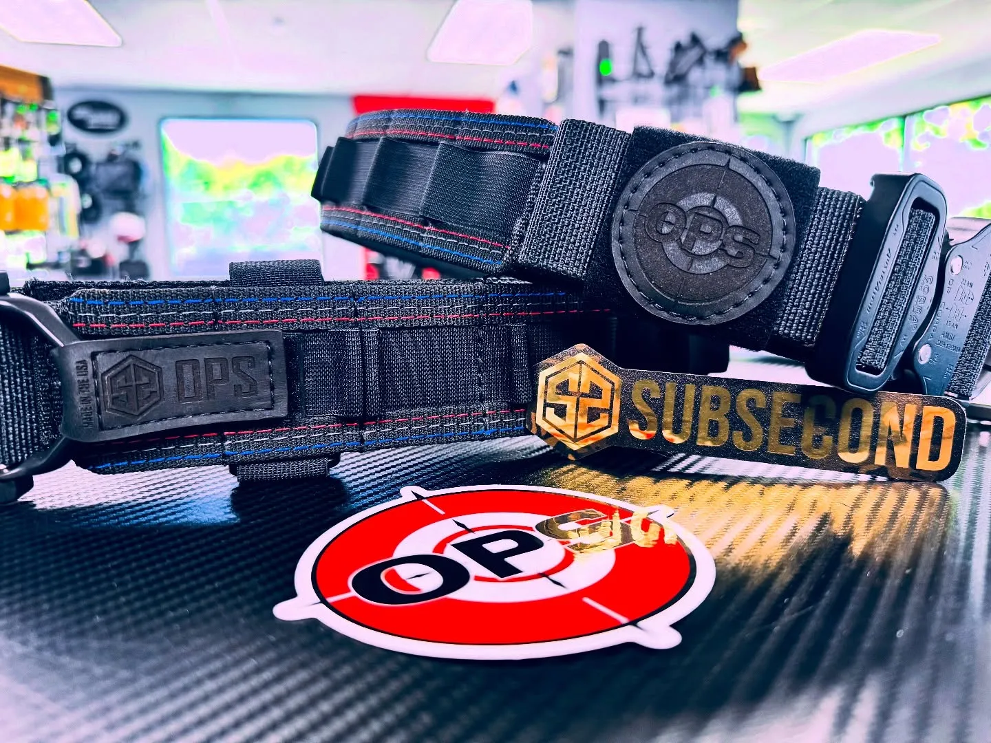 Custom On Point x SubSecond belt on the On Point shop counter